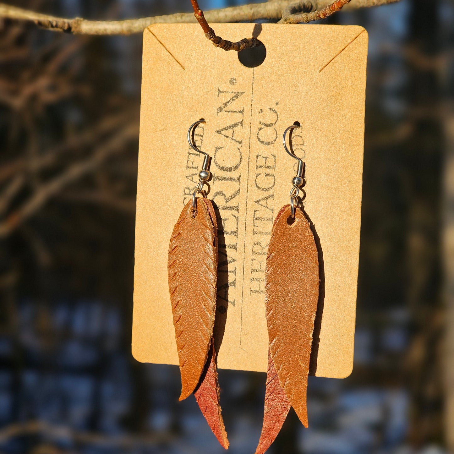 Double Feather Earrings, Buck Brown on Mahogany