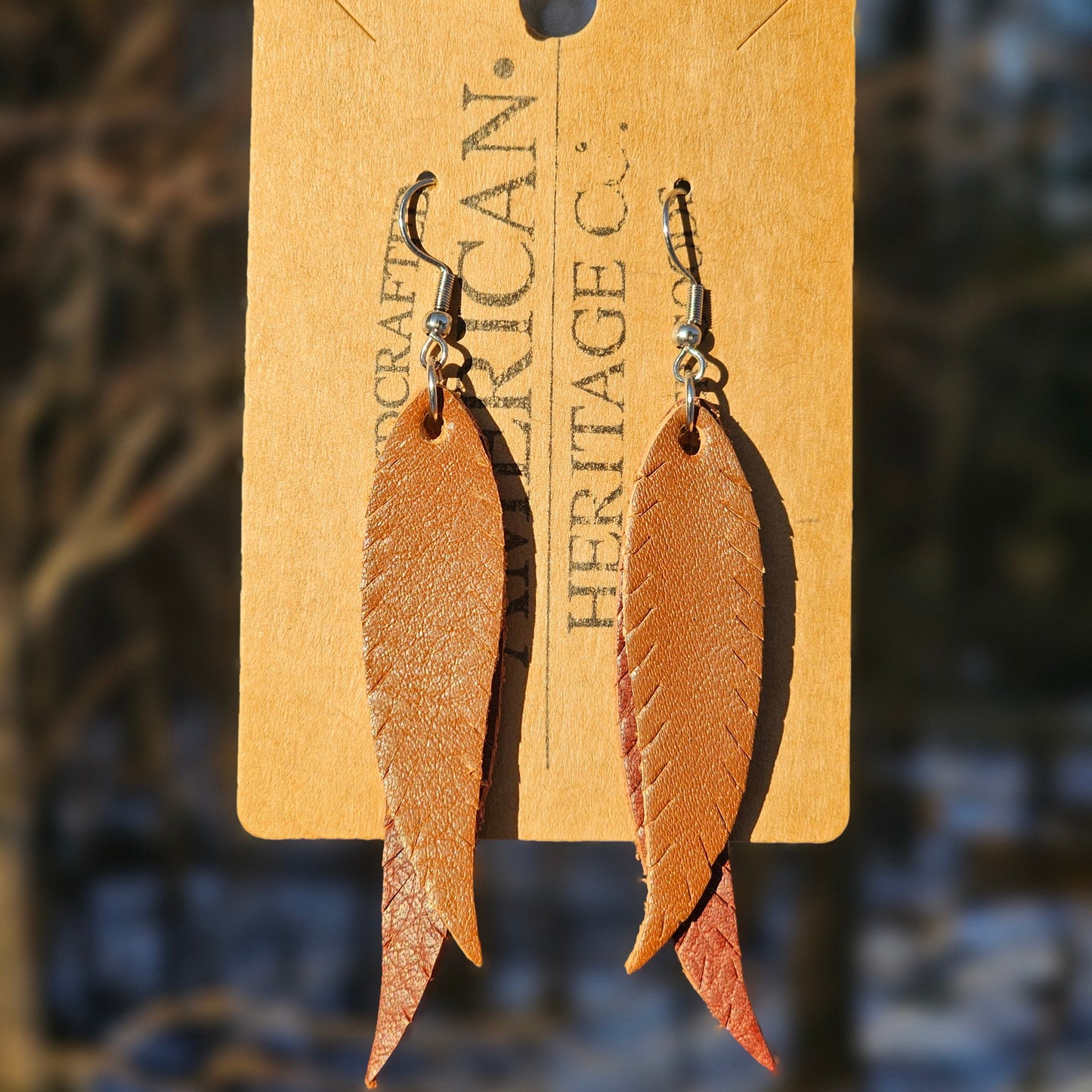 Double Feather Earrings, Buck Brown on Mahogany